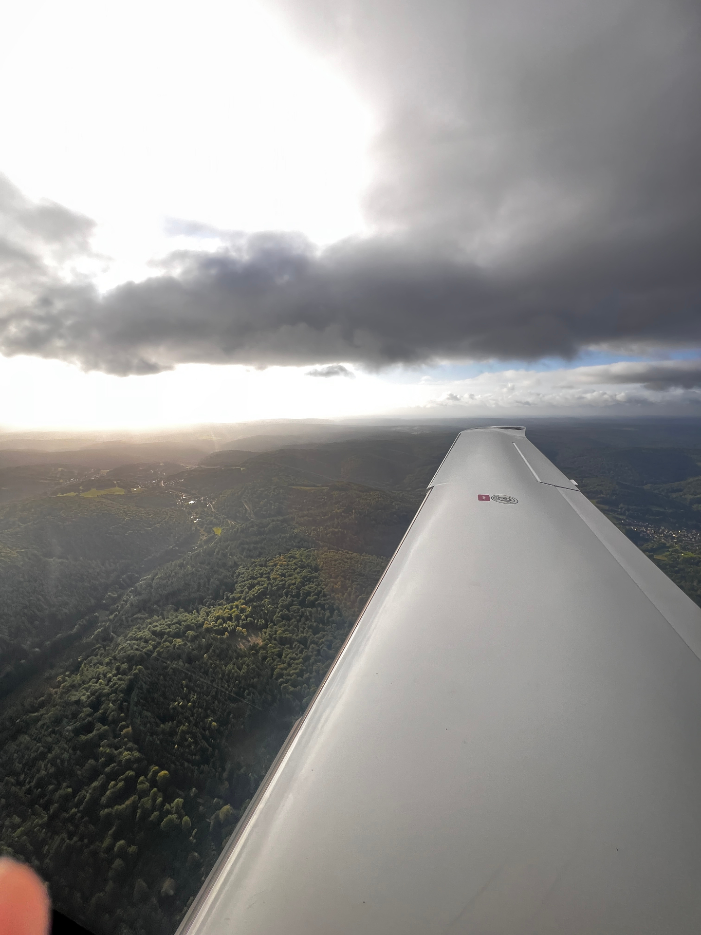 Wing over mountains at dusk